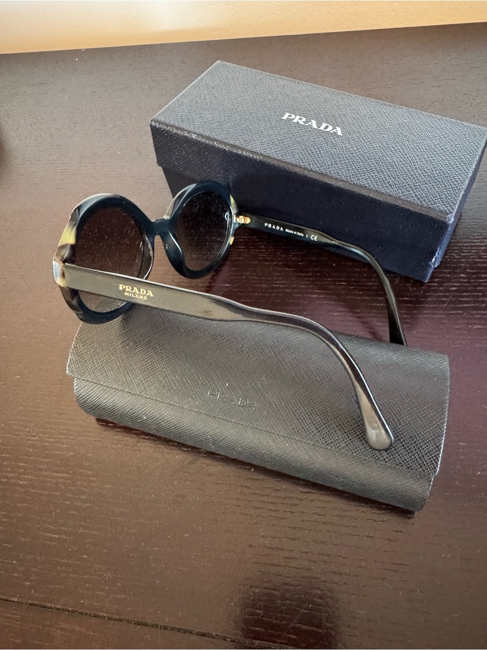 Prada Black Round Sunglasses with Subtle Gold Logo